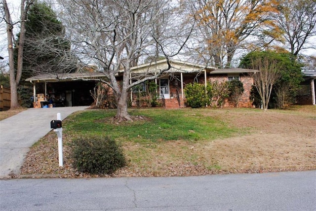 view of front facade with a front lawn and a carport