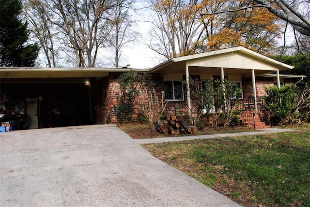 ranch-style house with a front lawn and a carport