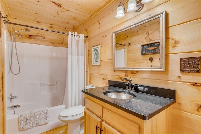 full bathroom featuring shower / bath combo, vanity, wood walls, and toilet