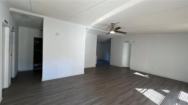 spare room with ceiling fan, lofted ceiling, and dark hardwood / wood-style flooring