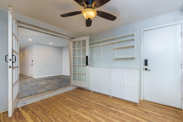 interior space featuring ceiling fan, french doors, and light hardwood / wood-style flooring