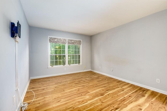 spare room featuring light hardwood / wood-style floors