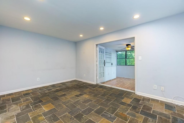 unfurnished room featuring ceiling fan