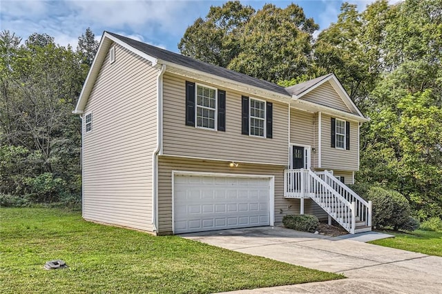 raised ranch with a front yard and a garage