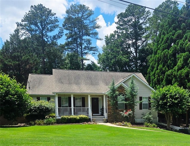 60 Stonehedge Dr, Buford, GA 30518 - view of front of house with a porch, a front lawn, and roof with shingles