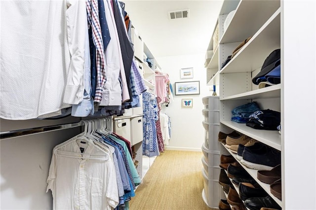 spacious closet featuring carpet floors and visible vents