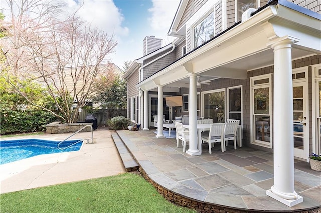 view of pool featuring a fenced in pool, a patio, and ceiling fan