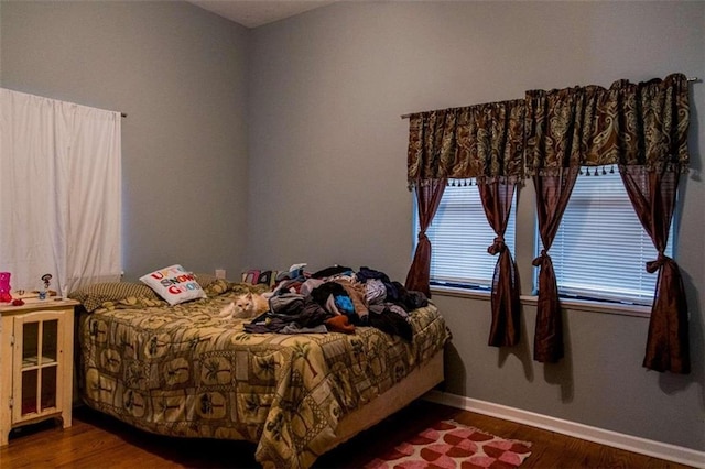 bedroom with wood-type flooring