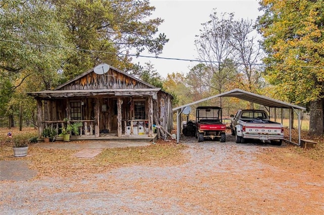 view of front facade with a carport and a porch