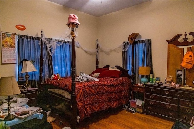 bedroom with wood-type flooring