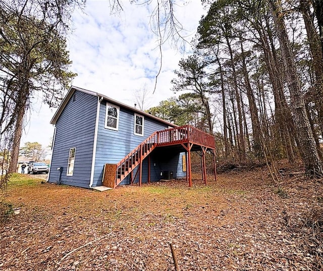 rear view of property with a wooden deck