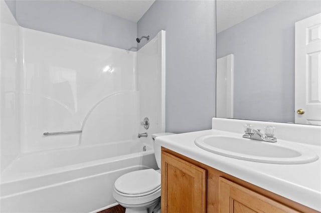 full bathroom featuring vanity, bathing tub / shower combination, and toilet