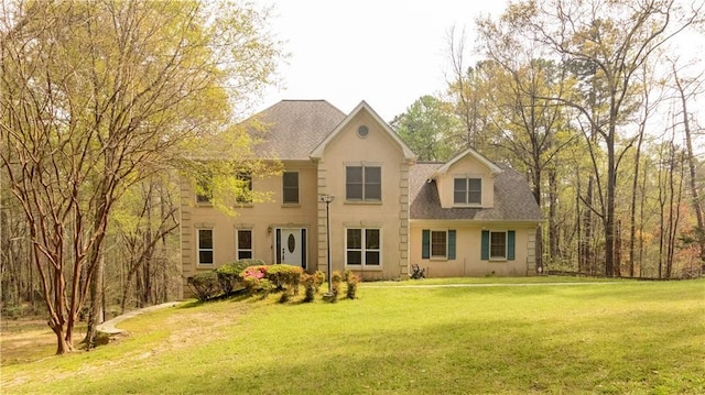 5150 Rockford Ln, Stockbridge, GA 30281 - colonial house featuring a front lawn, a shingled roof, and stucco siding