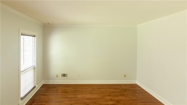 5150 Rockford Ln, Stockbridge, GA 30281 - unfurnished room featuring dark wood-style flooring, baseboards, visible vents, and crown molding