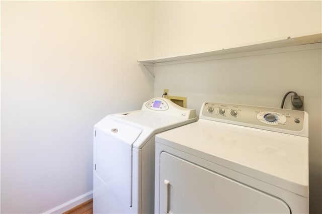 5150 Rockford Ln, Stockbridge, GA 30281 - clothes washing area featuring laundry area, baseboards, and washer and clothes dryer