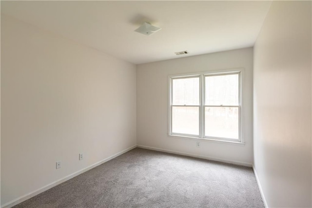 5150 Rockford Ln, Stockbridge, GA 30281 - spare room with light colored carpet, baseboards, and visible vents