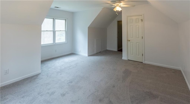 5150 Rockford Ln, Stockbridge, GA 30281 - additional living space with baseboards, vaulted ceiling, carpet flooring, visible vents, and ceiling fan