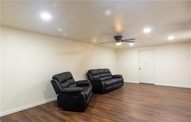5150 Rockford Ln, Stockbridge, GA 30281 - living area featuring dark wood-type flooring, baseboards, and a ceiling fan