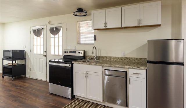 5150 Rockford Ln, Stockbridge, GA 30281 - kitchen featuring stainless steel appliances, dark wood-type flooring, white cabinets, and a sink