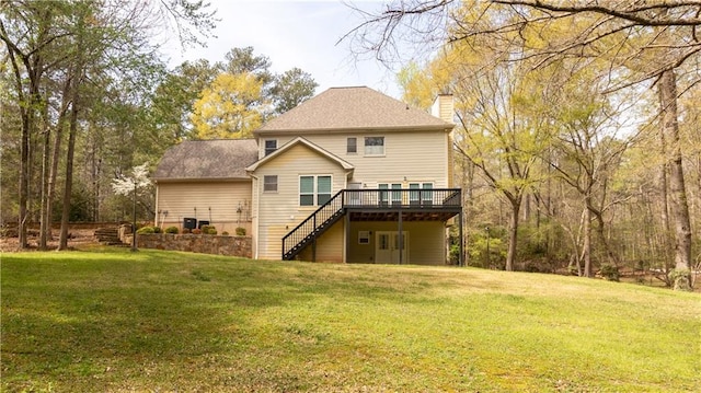 5150 Rockford Ln, Stockbridge, GA 30281 - back of property featuring a chimney, a wooden deck, a lawn, and stairs