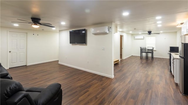 5150 Rockford Ln, Stockbridge, GA 30281 - living area featuring ceiling fan, recessed lighting, an AC wall unit, baseboards, and dark wood-style floors
