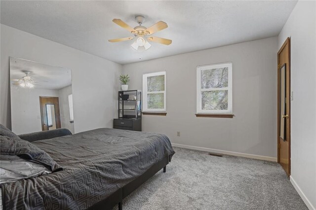 3916 S Martin Way, Lithia Springs, GA 30122 - carpeted bedroom with baseboards and a ceiling fan