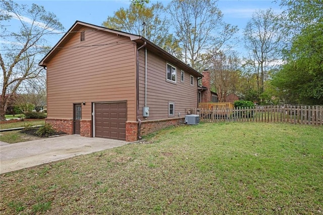 3916 S Martin Way, Lithia Springs, GA 30122 - view of home's exterior featuring fence, driveway, an attached garage, central air condition unit, and a yard
