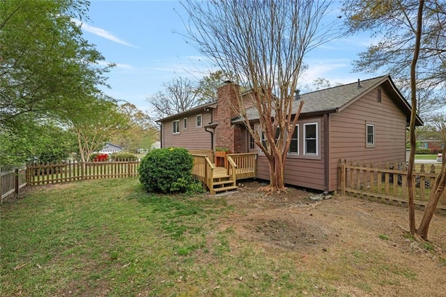 3916 S Martin Way, Lithia Springs, GA 30122 - back of property with a lawn, a fenced backyard, a chimney, and a deck
