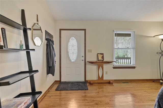 3916 S Martin Way, Lithia Springs, GA 30122 - entryway featuring baseboards, vaulted ceiling, and wood finished floors