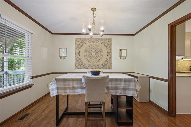 3916 S Martin Way, Lithia Springs, GA 30122 - dining room with visible vents, a chandelier, a wealth of natural light, and wood finished floors