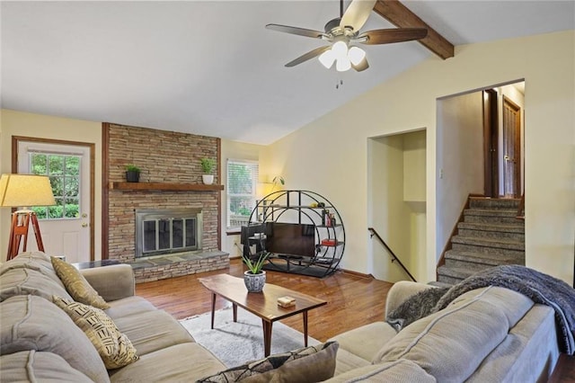3916 S Martin Way, Lithia Springs, GA 30122 - living area with a ceiling fan, vaulted ceiling with beams, plenty of natural light, and wood finished floors