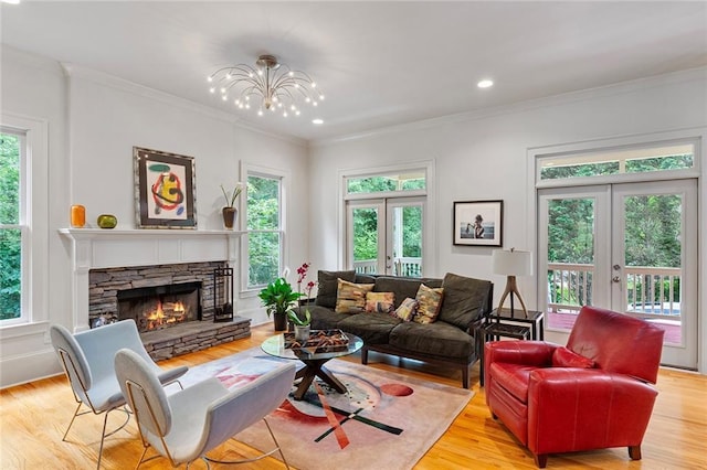 453 Carter Ave SE, Atlanta, GA 30317 - living area featuring french doors, plenty of natural light, a fireplace, ornamental molding, and recessed lighting