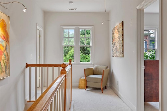 453 Carter Ave SE, Atlanta, GA 30317 - living area with plenty of natural light, an upstairs landing, and light colored carpet