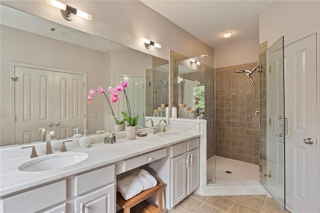 453 Carter Ave SE, Atlanta, GA 30317 - full bathroom featuring double vanity, a shower stall, and tile patterned floors