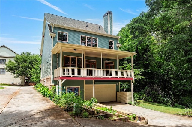 453 Carter Ave SE, Atlanta, GA 30317 - view of front of home featuring an attached garage, concrete driveway, a balcony, and a chimney