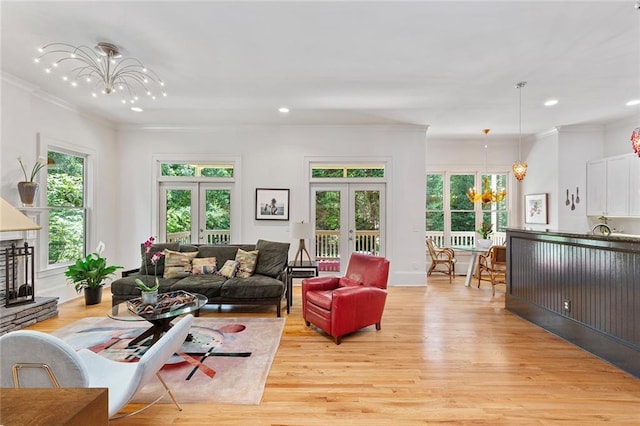 453 Carter Ave SE, Atlanta, GA 30317 - living area featuring a chandelier, light wood finished floors, recessed lighting, french doors, and ornamental molding