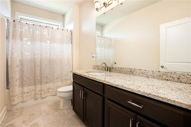 full bath featuring toilet, shower / tub combo with curtain, and vanity