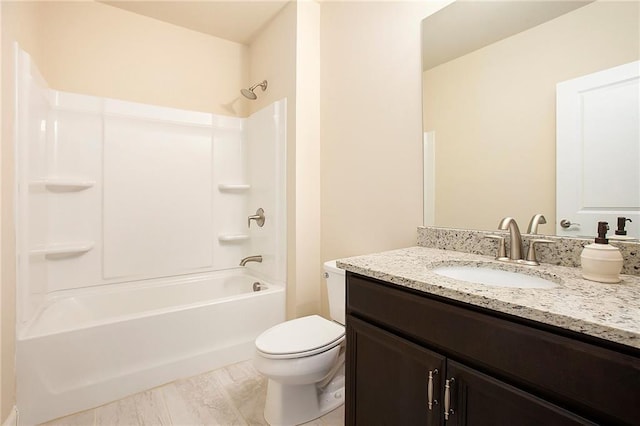 full bathroom featuring toilet, shower / bath combination, and vanity