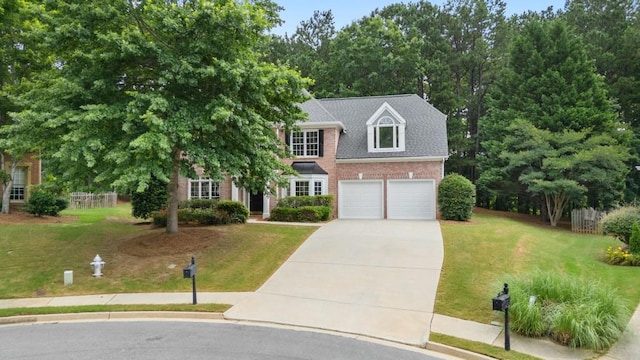 2934 Mill Grove Ter, Dacula, GA 30019 - view of front of home featuring brick siding, driveway, a front lawn, and an attached garage