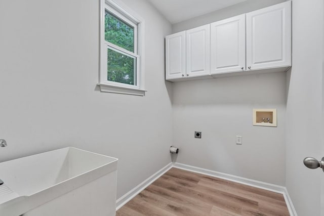 2934 Mill Grove Ter, Dacula, GA 30019 - laundry room featuring washer hookup, electric dryer hookup, cabinet space, and light wood finished floors