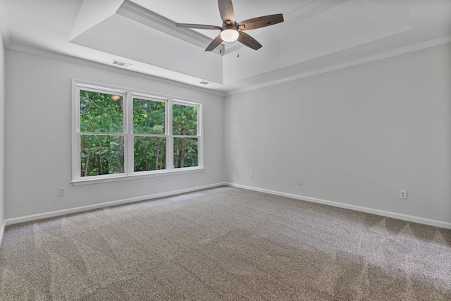 2934 Mill Grove Ter, Dacula, GA 30019 - carpeted spare room featuring a raised ceiling, a ceiling fan, and ornamental molding