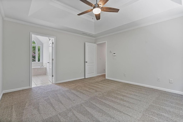 2934 Mill Grove Ter, Dacula, GA 30019 - carpeted spare room featuring a tray ceiling, ceiling fan, and crown molding