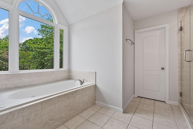 2934 Mill Grove Ter, Dacula, GA 30019 - full bath featuring tile patterned floors, a bath, a stall shower, and vaulted ceiling