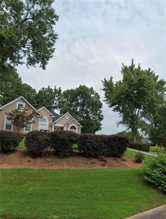 exterior space featuring a front lawn