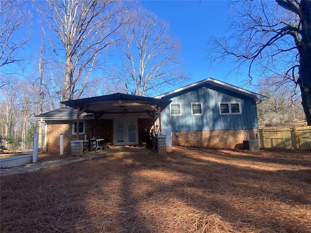 view of front of house featuring french doors and central air condition unit