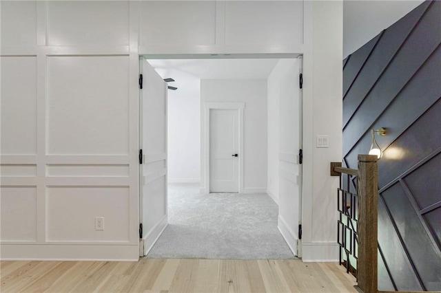 hallway with light wood-style floors