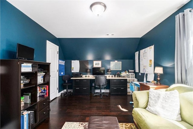 home office featuring visible vents, dark wood-type flooring, and lofted ceiling