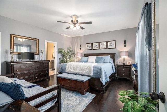 bedroom with a ceiling fan and dark wood-type flooring