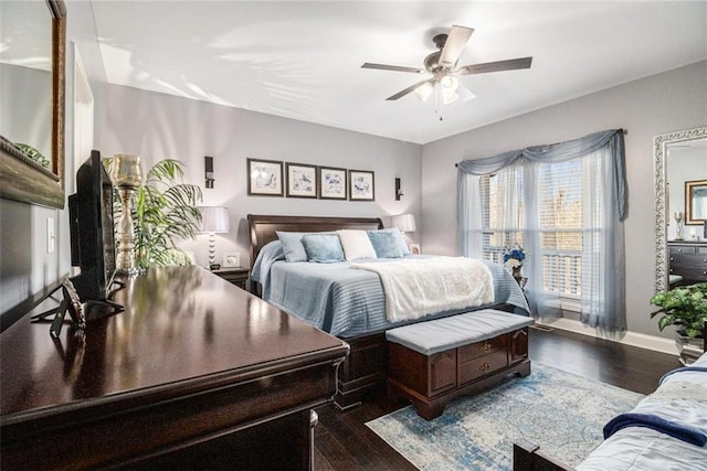 bedroom featuring ceiling fan, baseboards, and dark wood-style floors