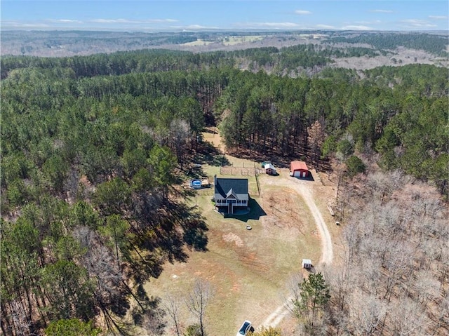 bird's eye view featuring a forest view